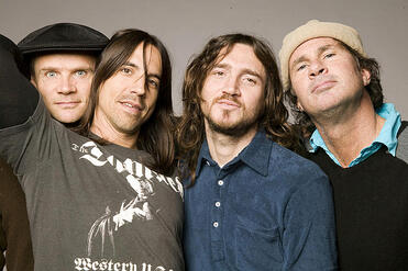 The band Red Hot Chili Peppers. Pictured from left to right, Michael Balzary (Flea) on bass, Anthony Kiedis on vocals, John Frusciante on guitar, and Chad Smith on drums.